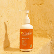 Serenade Radiance Rush Body Wash with Grapefruit, Mandarin and Orange essential oils placed in a warm setting for energising aromatherapy body cleansing